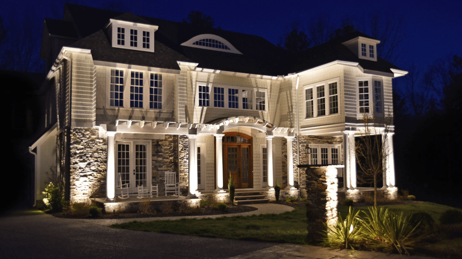 white home with outdoor lighting